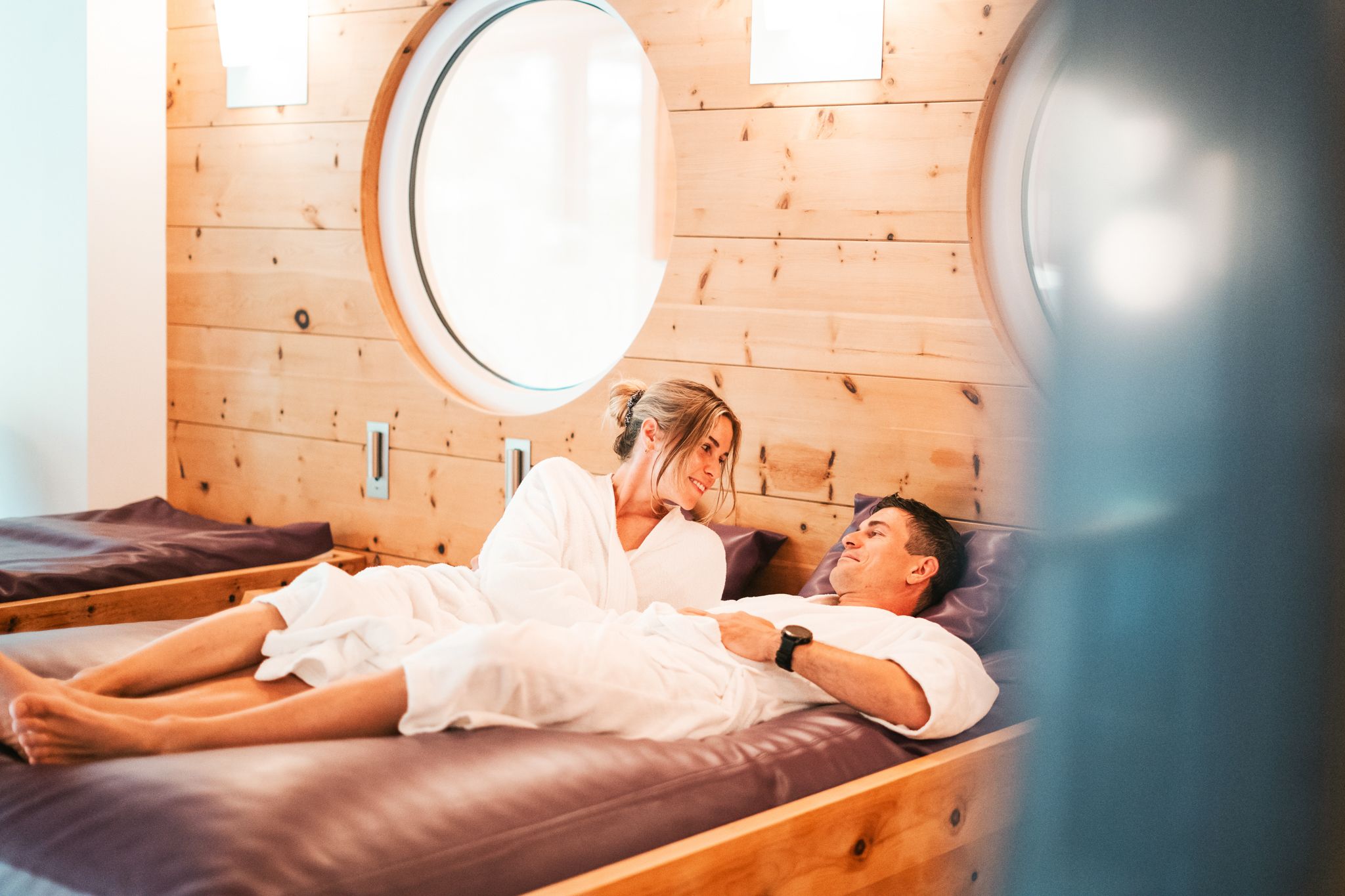 A couple relaxes at Glemmtalerhof in Hinterglemm, enjoying their time together.