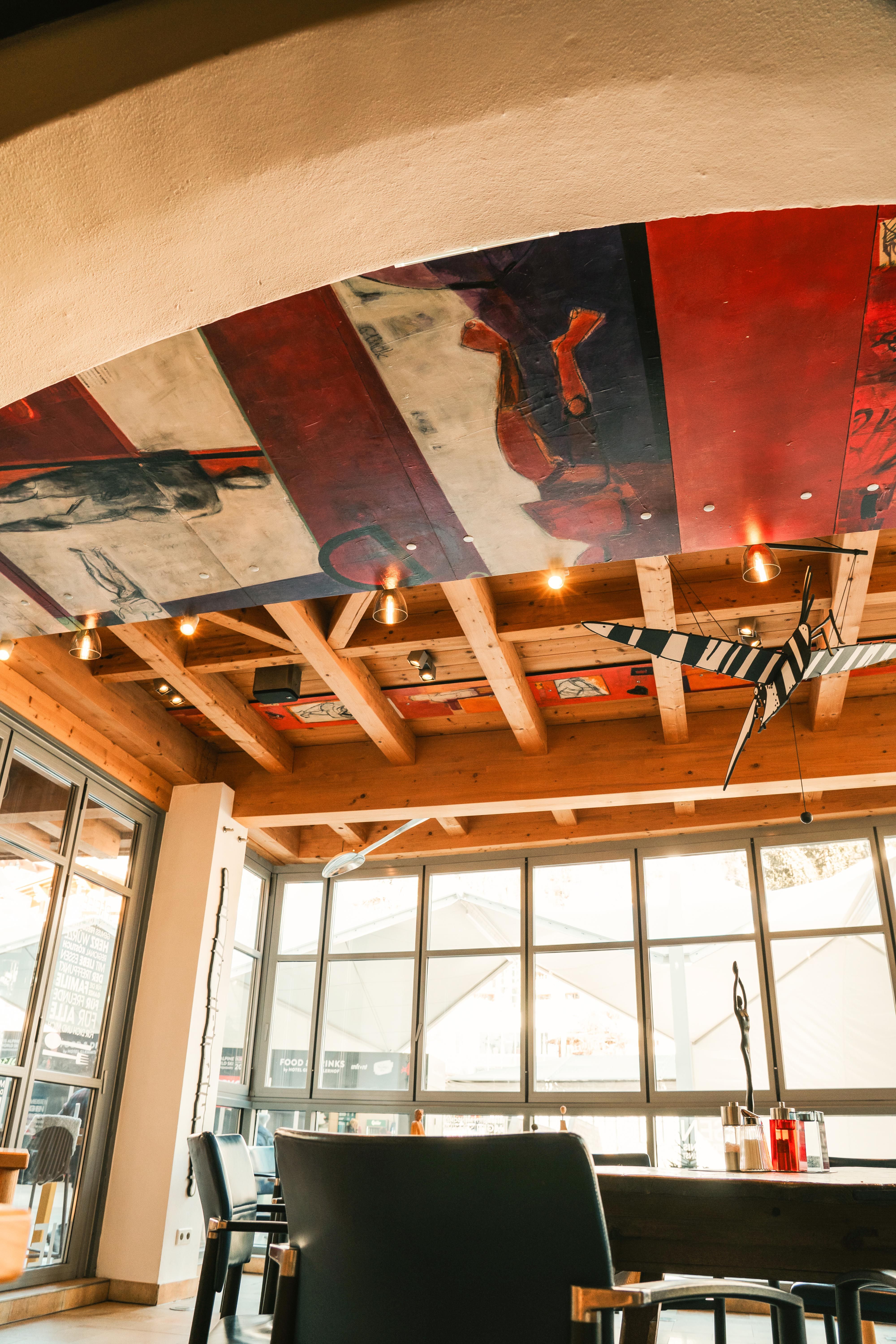 Glemmtalerhof in Hinterglemm features modern furniture and artistic ceiling design, creating a cozy atmosphere.