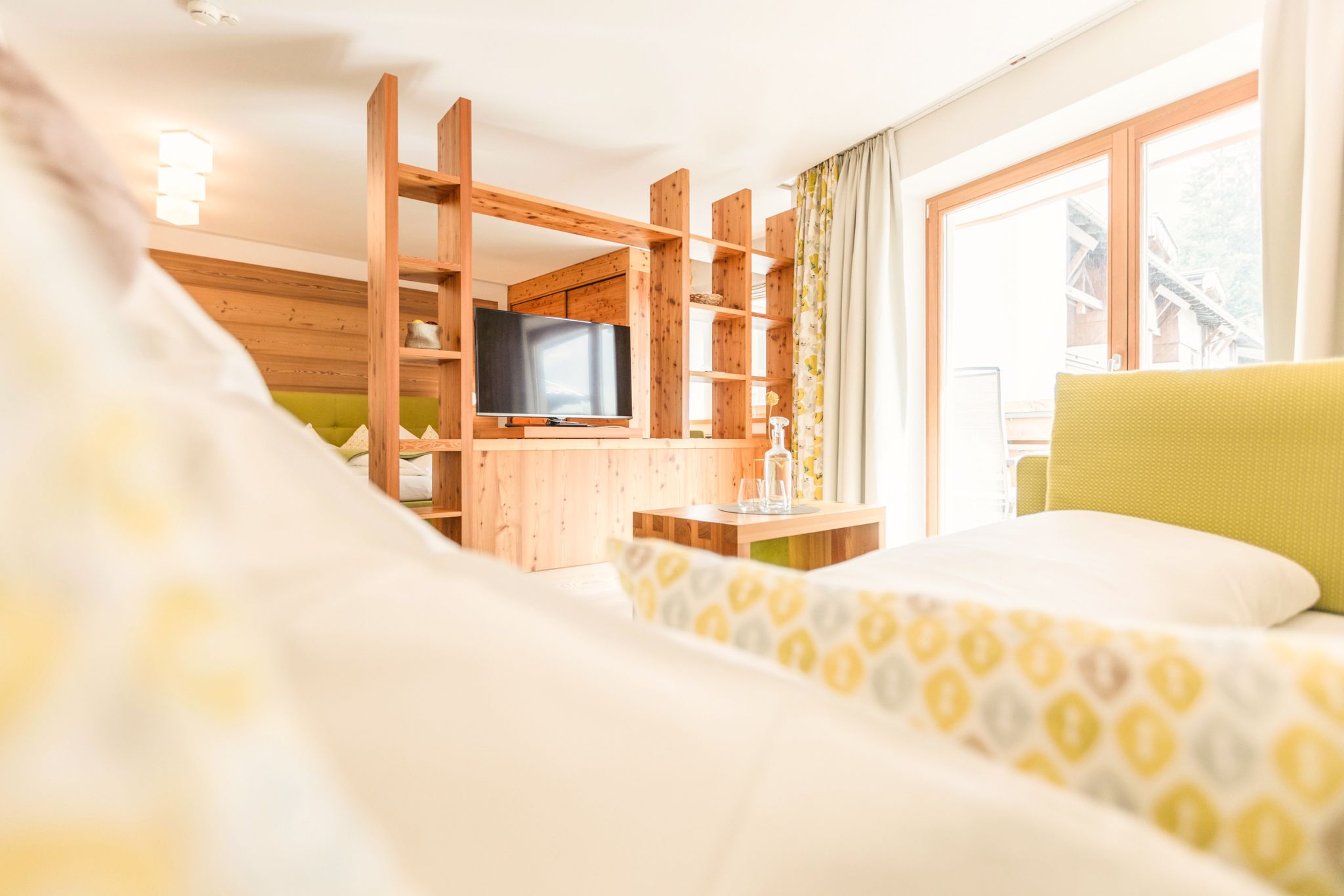 A modern room in Glemmtalerhof, cozy and bright with wooden details.