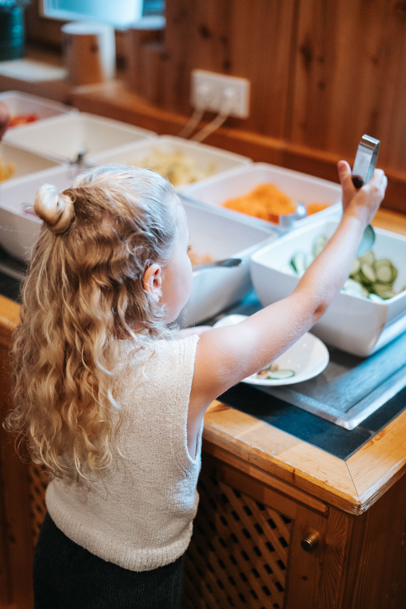 A girl picks healthy snacks at Glemmtalerhof in Hinterglemm.
