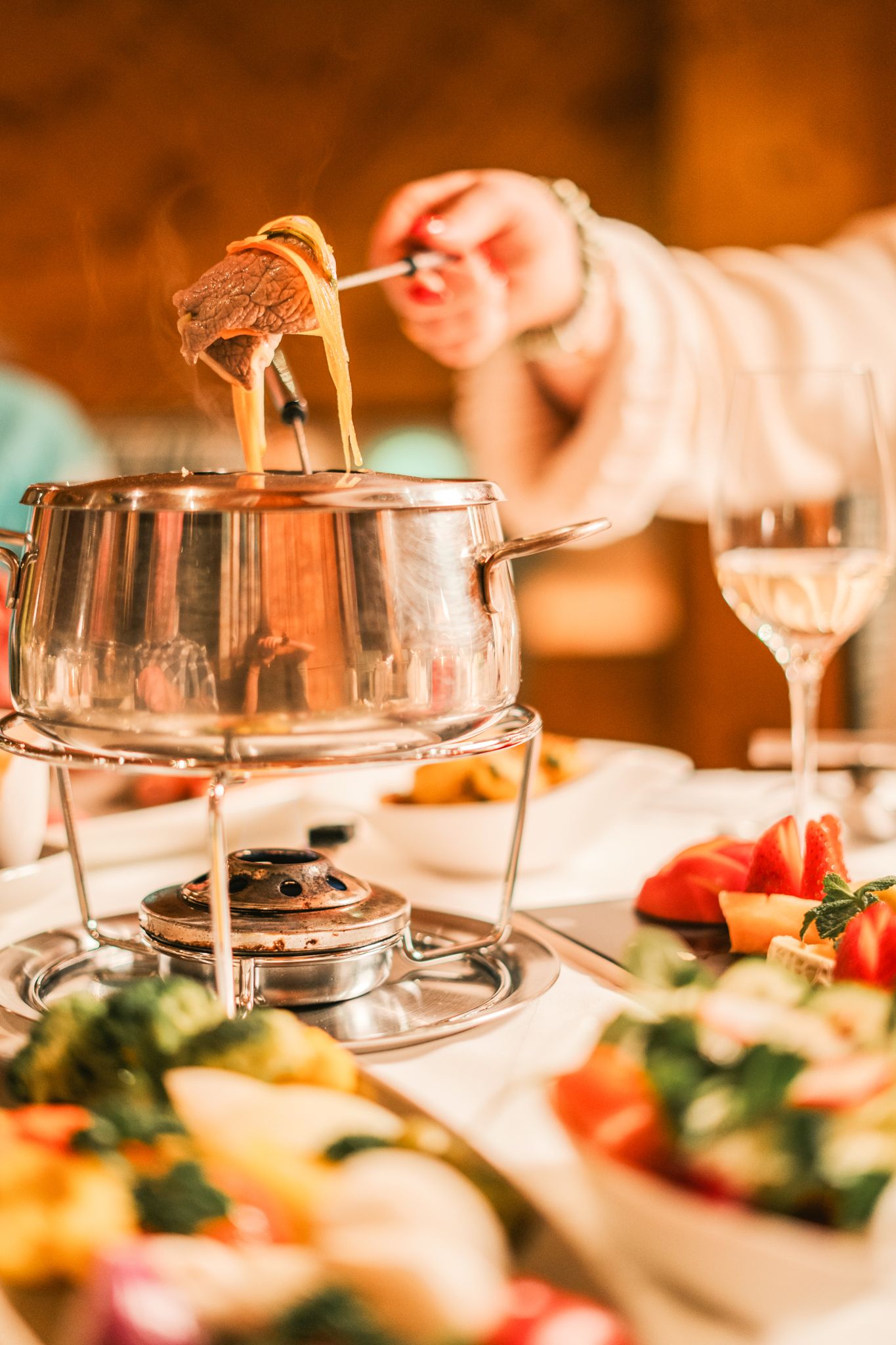 A delicious fondue at Glemmtalerhof, surrounded by fresh vegetables and a lovely atmosphere.