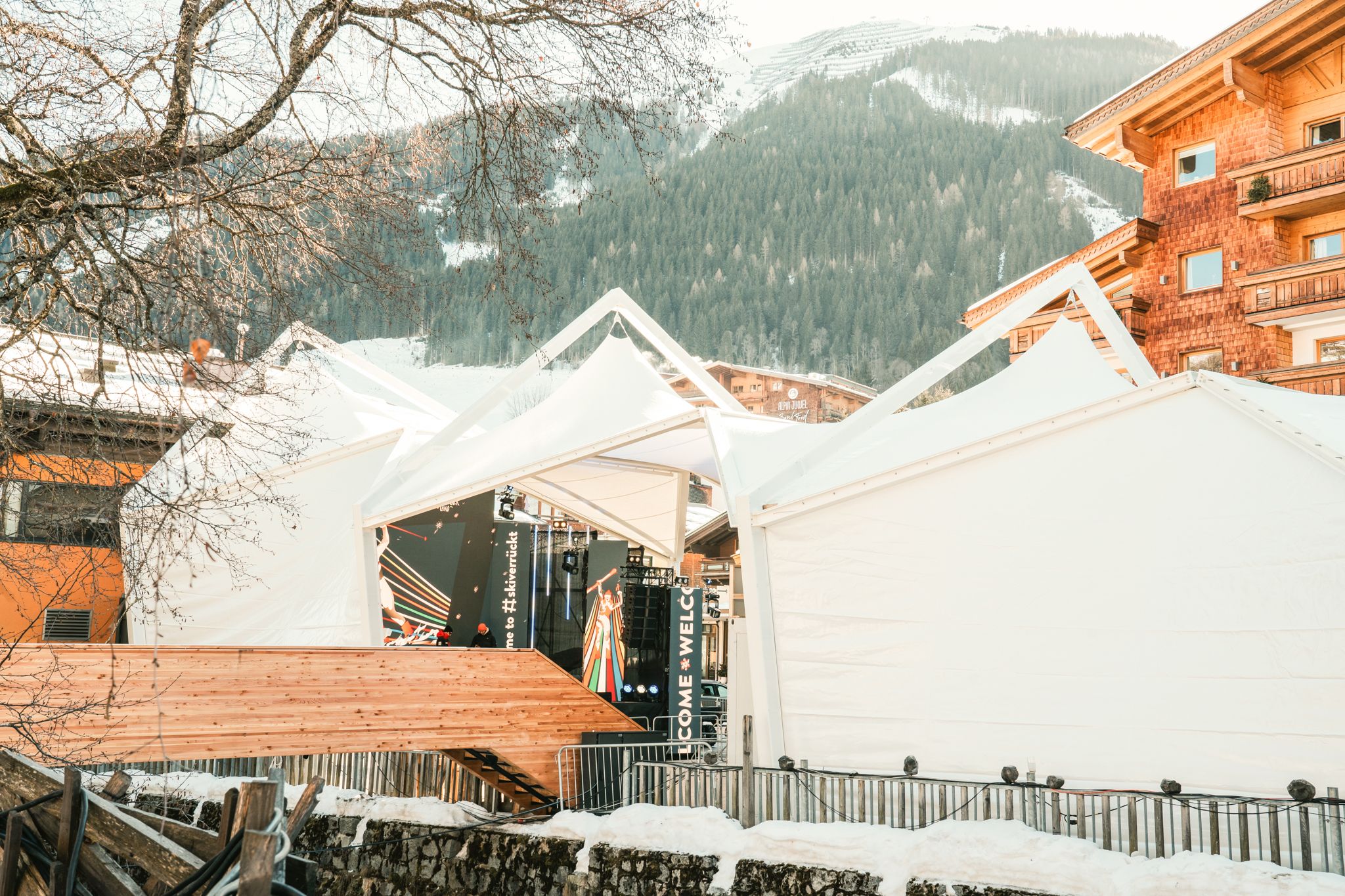 Tents in Glemmtal, surrounded by mountains and snowy landscapes.