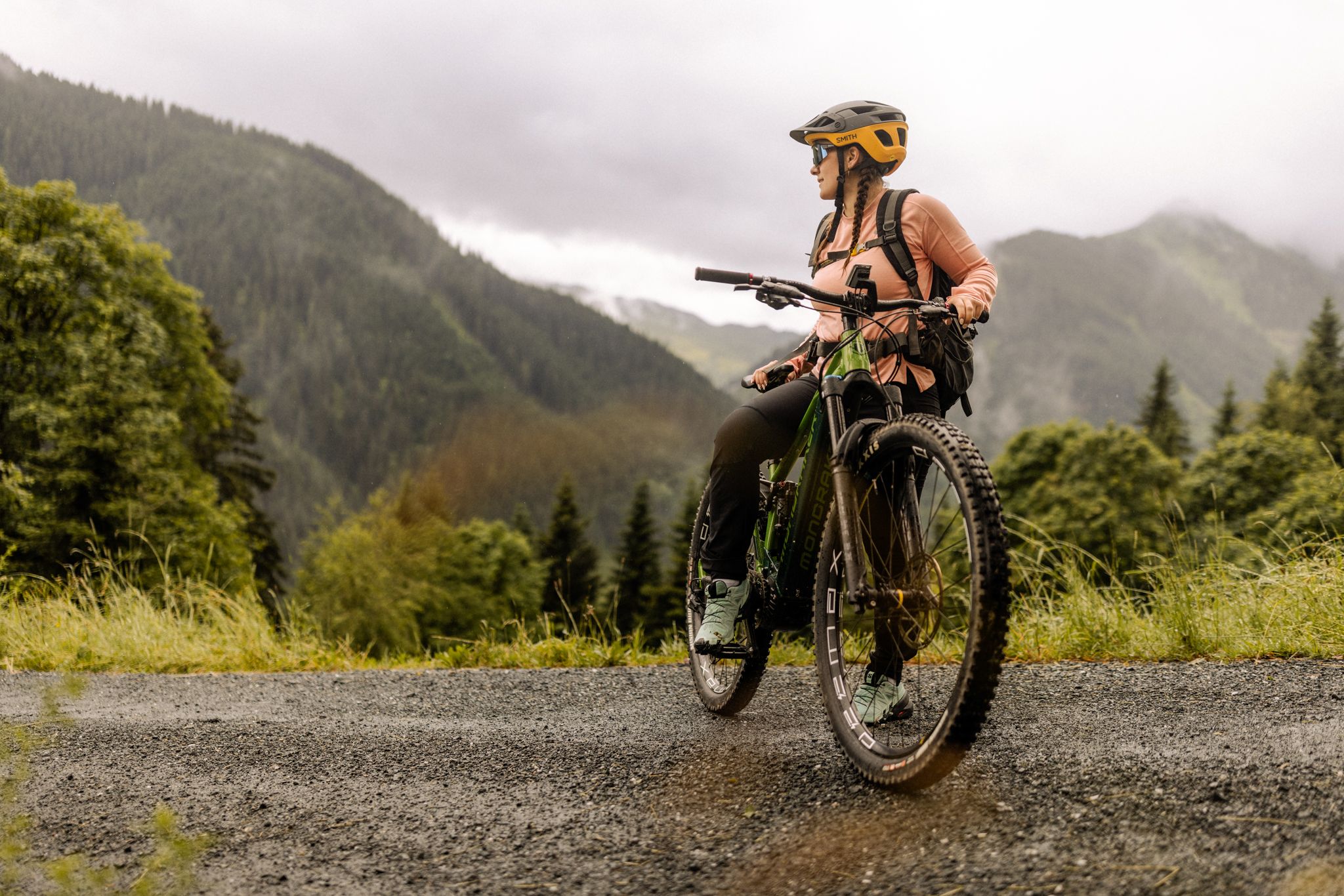 A cyclist enjoys the view in the Glemmtal near Hinterglemm.