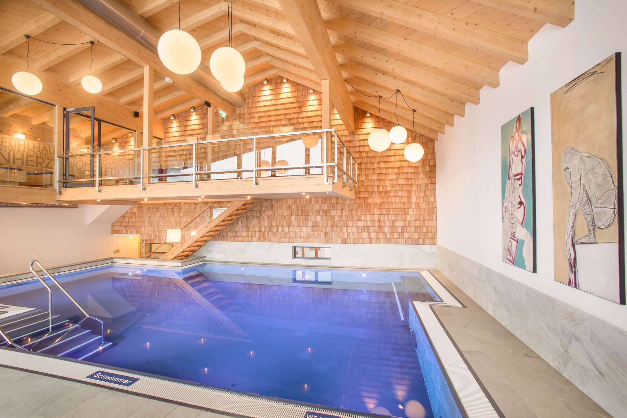 Glemmtalerhof in Hinterglemm features a modern pool and wooden decor.