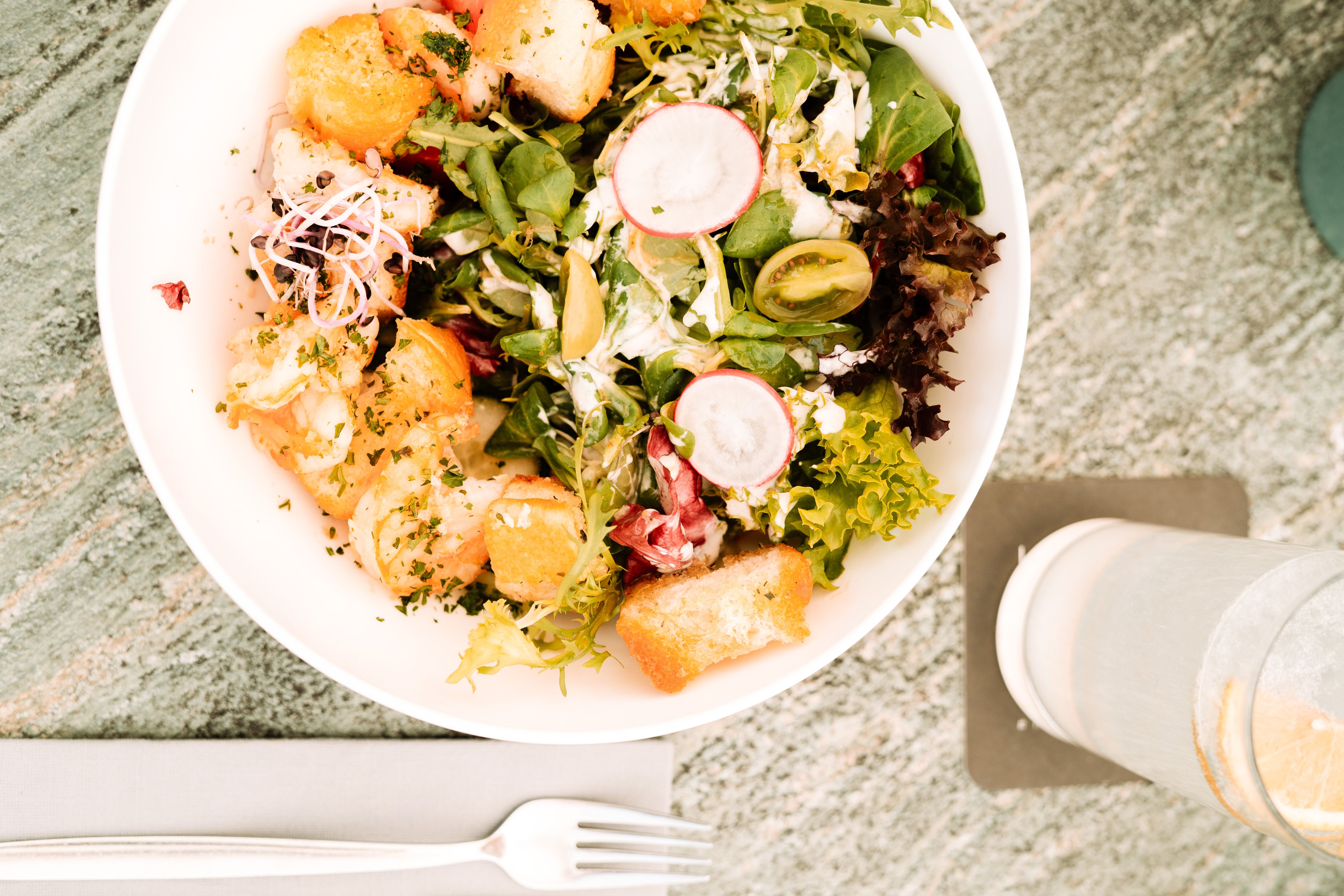 Fresh salad at Glemmtalerhof, surrounded by tasty ingredients and croutons.