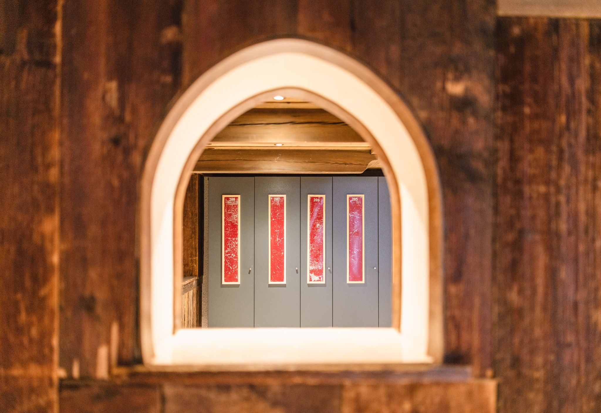 View through an arch at room doors in Glemmtalerhof.