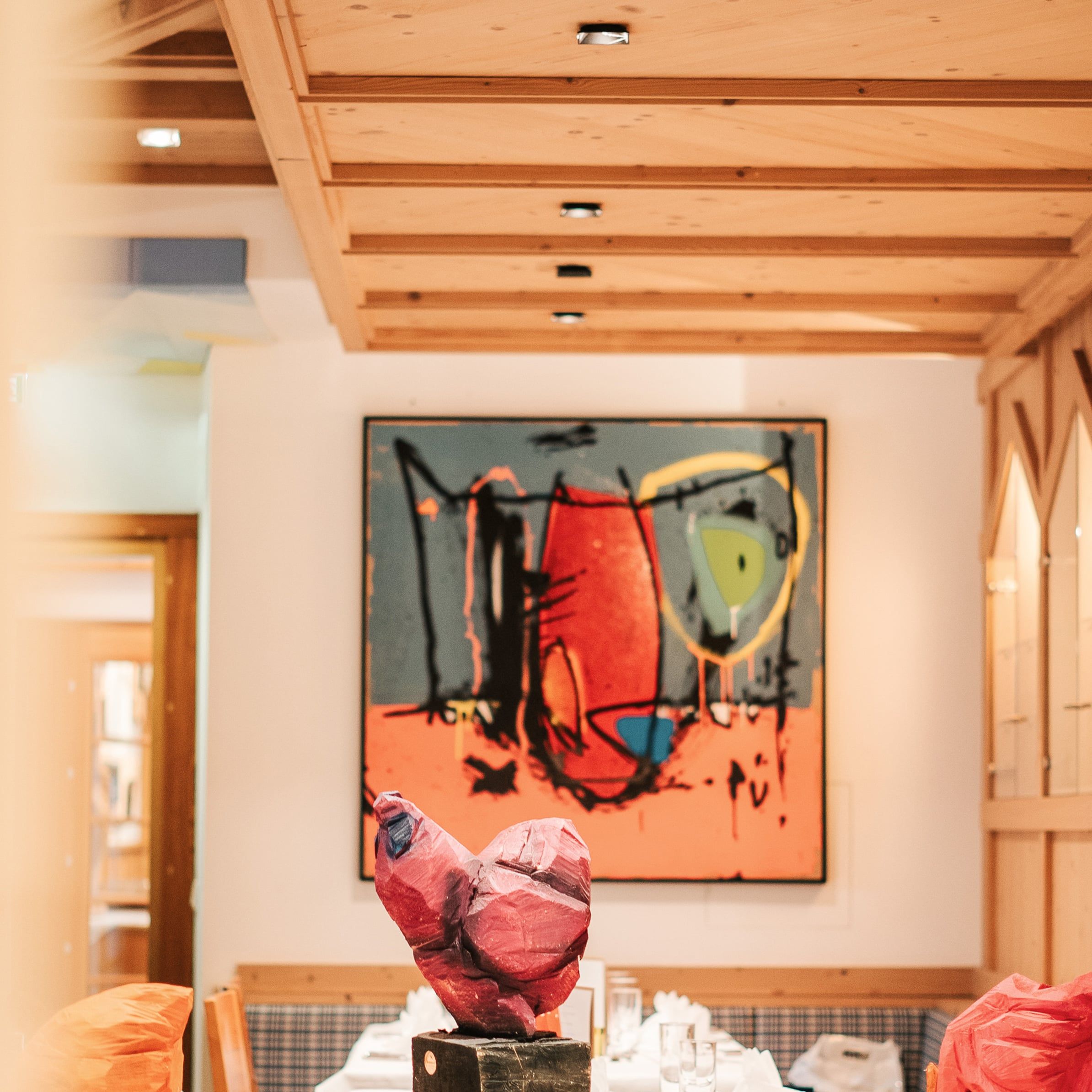 Colorful artwork and wood decor in the Glemmtalerhof in Hinterglemm.