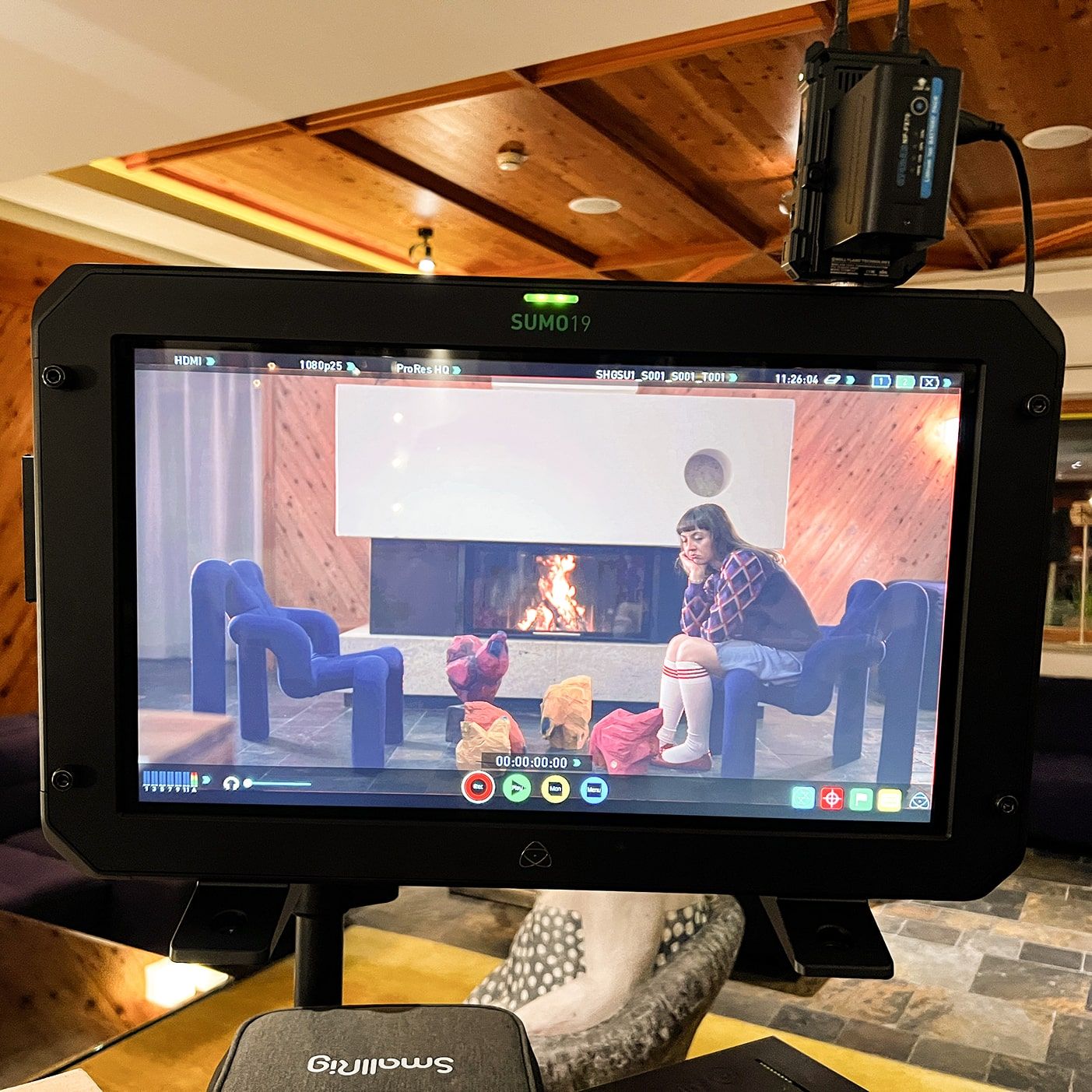 A scene is being filmed in Glemmtalerhof in Hinterglemm by a fireplace.