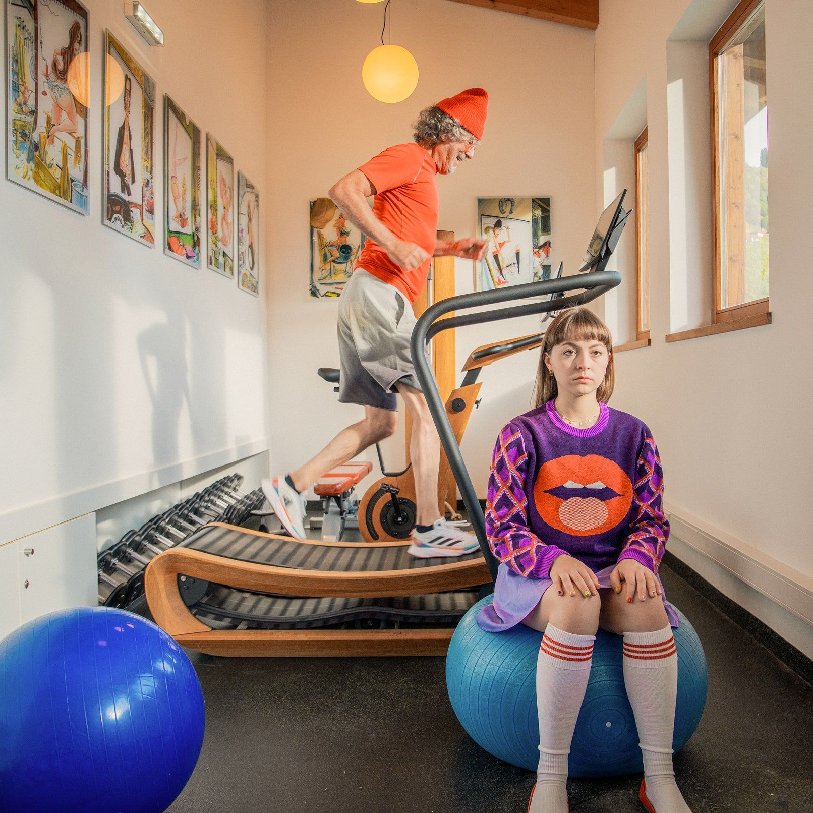 A man runs on a treadmill in the Glemmtalerhof gym, while a woman sits on an